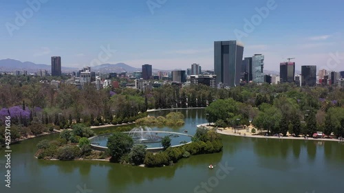 Aerial Shot of the lake and park of Chapultepec and panoramic view of Mexico city photo