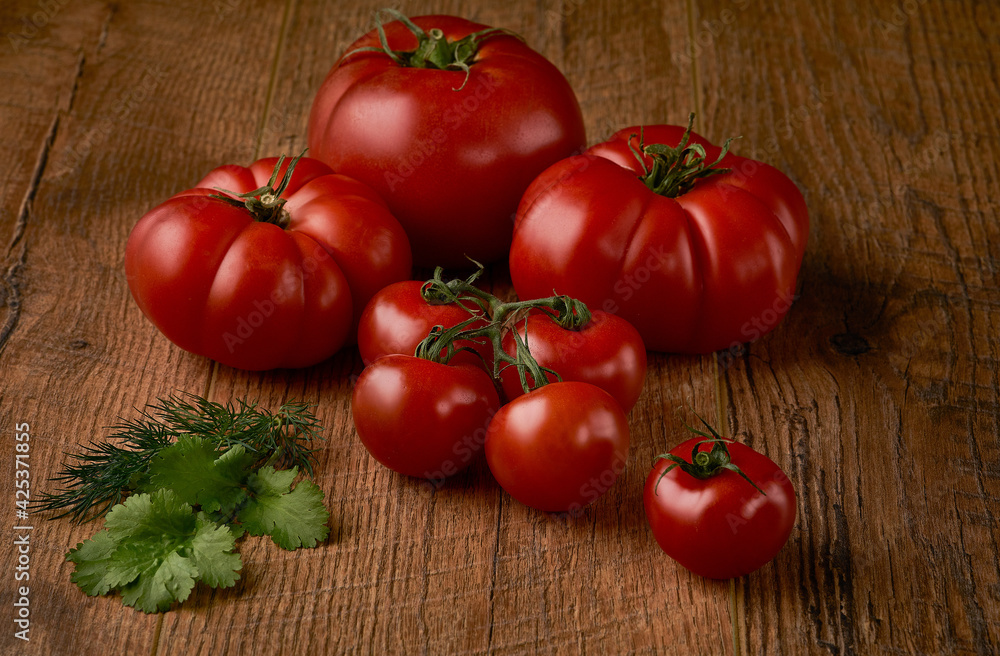 Tomatoes on rustic wooden background. High quality photo Tomatoes on rustic wooden background. High quality photo