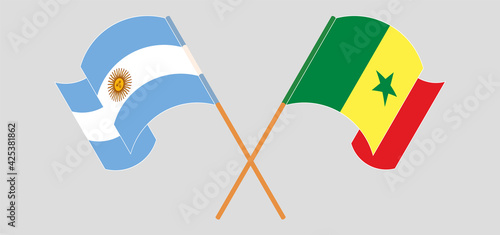Crossed and waving flags of Argentina and Senegal