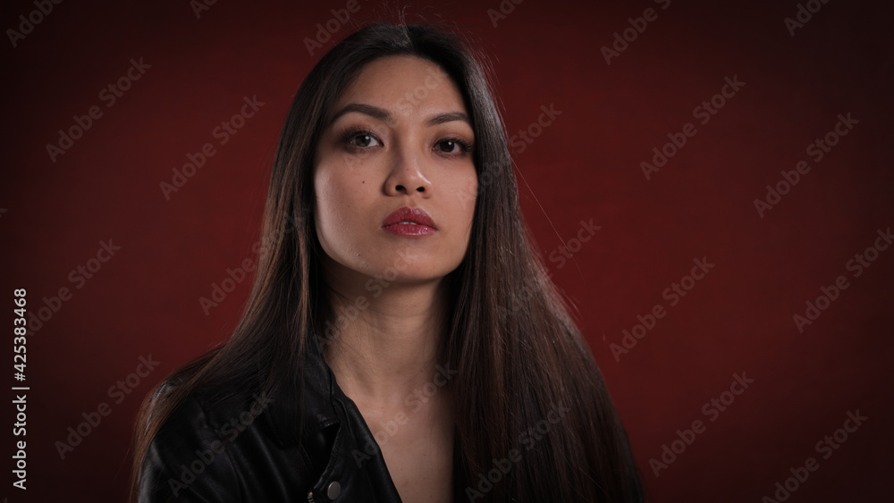 Portrait of a confident young woman - studio photography