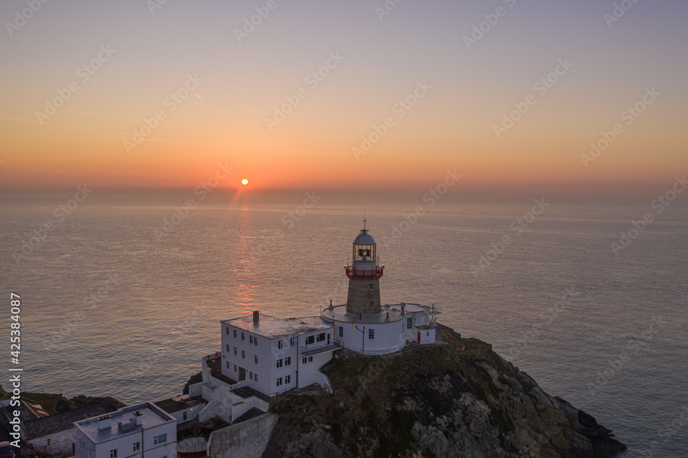 Aerial view of Howth Lighthouse at sunrise, beautiful Irish coastline Lighthouse.