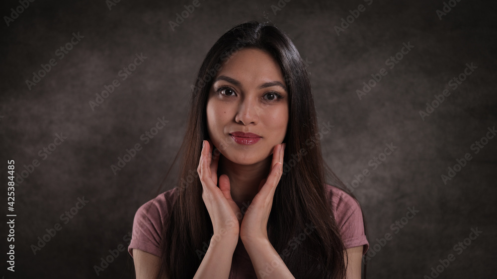 Fototapeta premium Studio portrait of a pretty Asian girl - studio photography