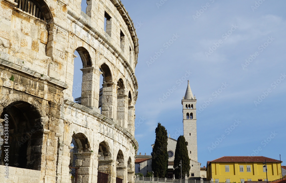 The bell tower of the Church of Saint Anthony of Padua near the Roman amphitheater in the Croatian city of Pula