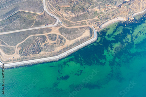 Seashore with turquoise water. Conceptual photo - sea and coast. Helicopter view.