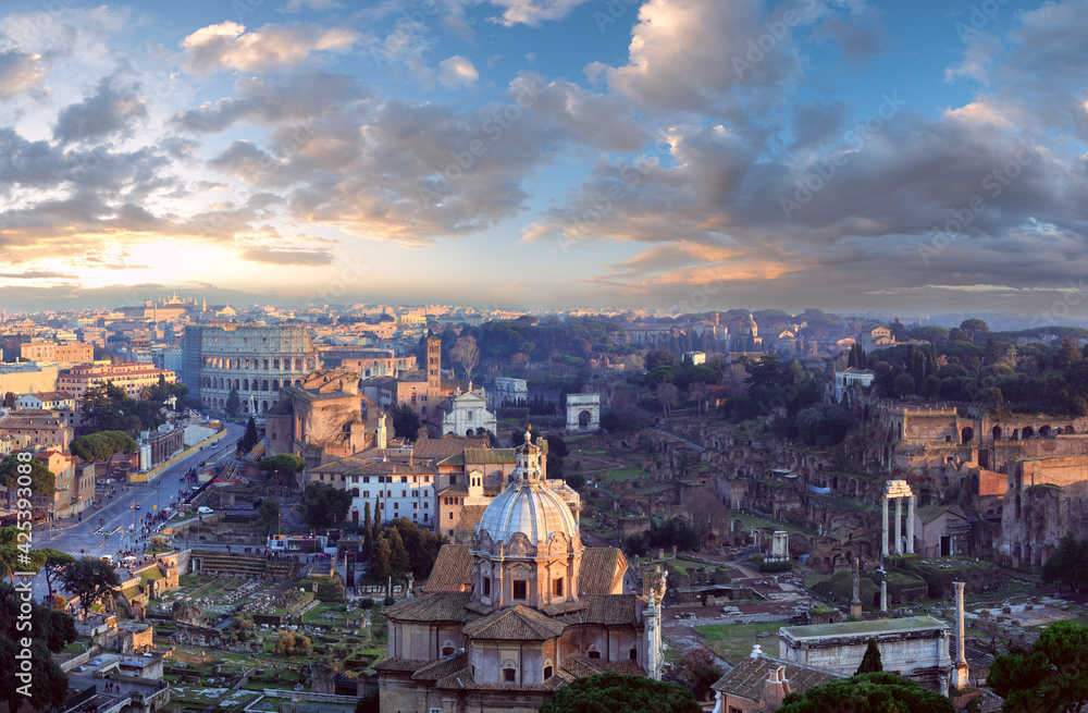 Ruins of Roman Forum. Rome City evening view from II Vittoriano top. People are unrecognizable.