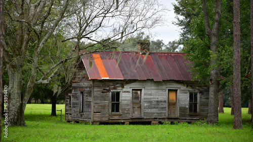 old abandoned farm house with rusty tin roof in North Florida