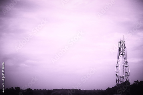 telecommunication tower against the purple sky- a conceptual photo with space to write your text 