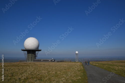 a view of the radar station at Titterstone Clee summit with the sky clear blue
