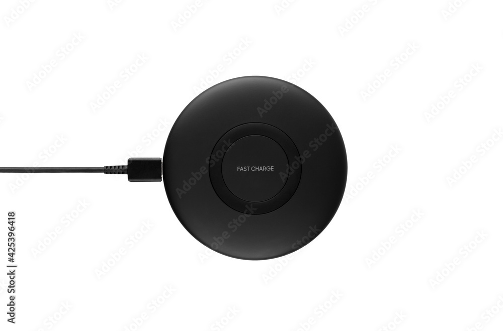 Wireless charging for a smartphone on a white background. Fast wireless charger close-up.Top View. Wireless charging for a smartphone on a white background. Fast wireless charger close-up.Top View.
