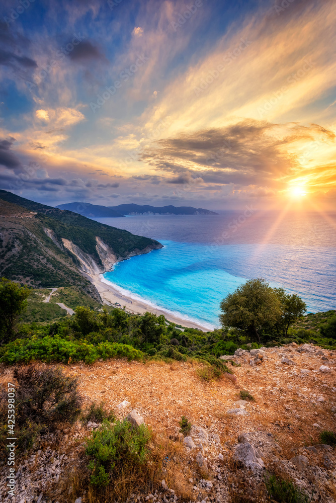 Beautiful summer sunset over the Myrtos beach in Greece