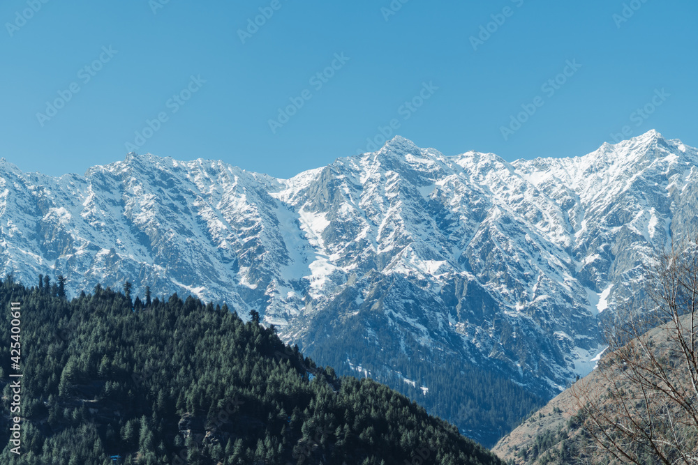 View of The Seven Sisters Peak mountains covered by snow as seen from the Solang valley in Manali, Himachal Pradesh, India