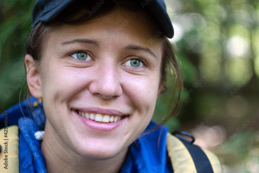 Portrait of young beautiful smiling woman without makeup in the forest. Natural beauty. Portrait of young beautiful smiling woman without makeup in the forest. Natural beauty.