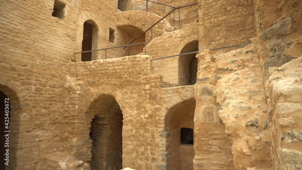 The ancient fortress of Ribat in Monastir, Tunisia. Old yellow bricks. View of the fortress from the bottom up