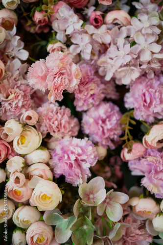 The concept of a delicious aroma of flowering in spring and summer. The flowers of roses, peonies, carnations are very much made of artificial plastic. 
