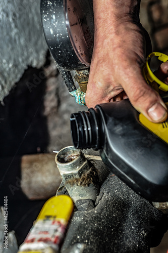 Worker repairs a pipe