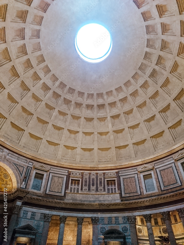 Pantheon oculus in Rome, Italy. Dome open window in roof, interior. Inside famous antique roman temple with a dome hemisphere and colonnade