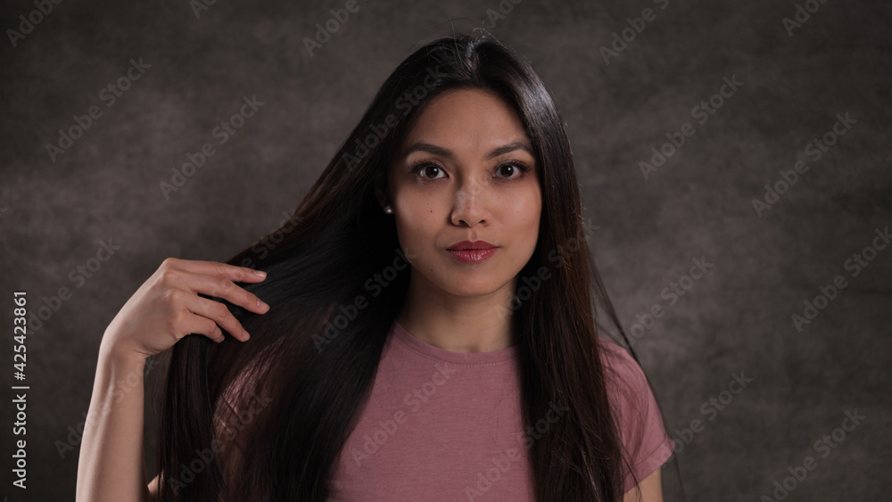 Fototapeta premium Portrait of a pretty Asian woman - studio photography