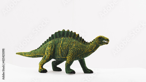 plastic toy dinosaur on white background © Mario