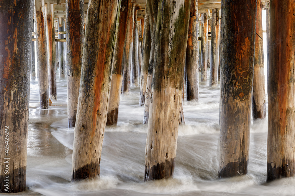 Below Santa Cruz Wharf at high tide. Santa Cruz, California, USA. Below Santa Cruz Wharf at high tide. Santa Cruz, California, USA.