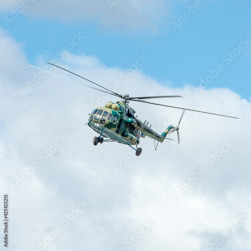 Fototapeta Naklejka Na Ścianę i Meble -  Military helicopter mi8 flies in the clouds