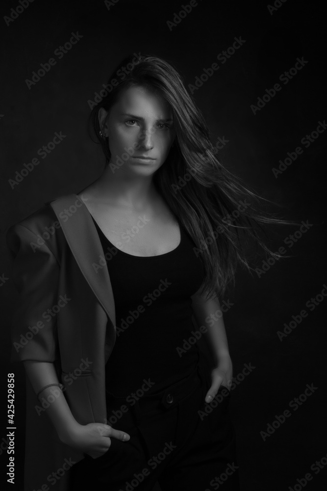 Black and white portrait of a young girl with long hair