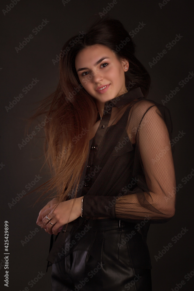 portrait of a young woman with long brown hair. portrait of a young woman with long brown hair.