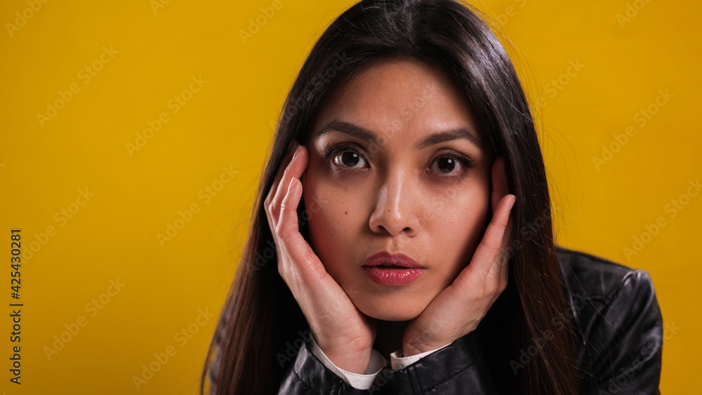 Young woman with a pretty face poses for the camera - studio photography Young woman with a pretty face poses for the camera - studio photography