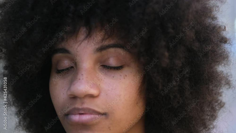 portrait and close up of beautiful young African or American woman with close eyes dreaming or thinking
portrait and close up of beautiful young African or American woman with close eyes dreaming or thinking