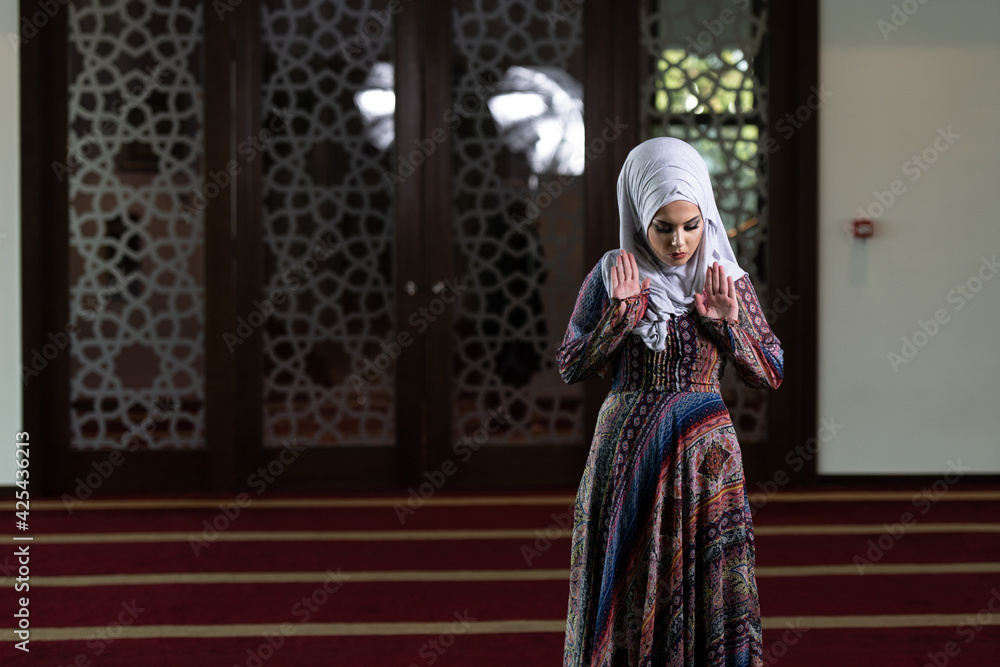 Muslim Woman Is Praying in the Mosque