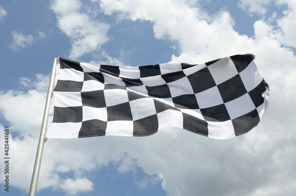checkered flag on blue sky background
