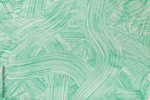 Abstract art background light green colors. Watercolor painting on canvas with cyan strokes and splash.