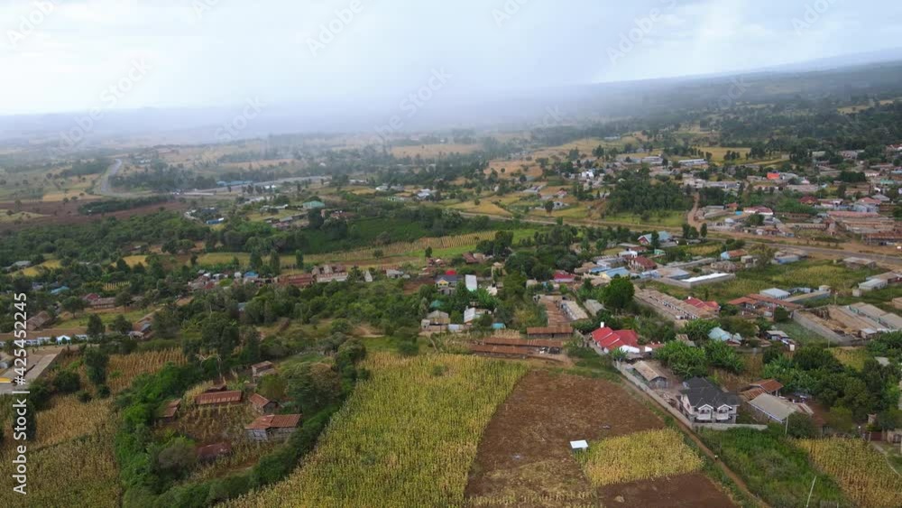 Aerial drone view of a rural village in Kenya, gloomy morning, rain coming in Aerial drone view of a rural village in Kenya, gloomy morning, rain coming in