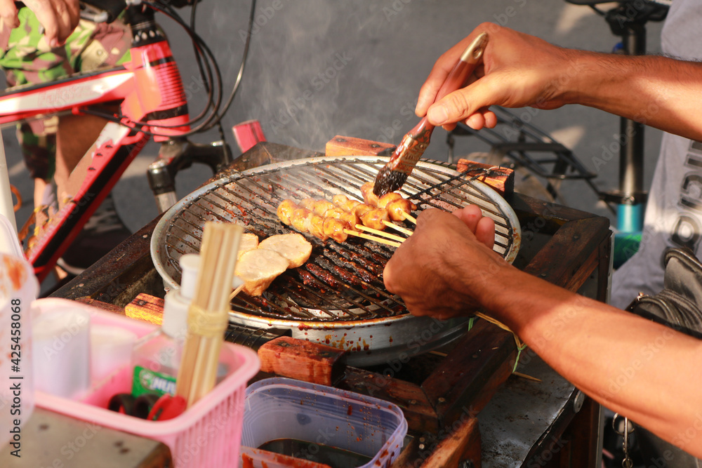 Delicious tasty indonesian street food on a grill.