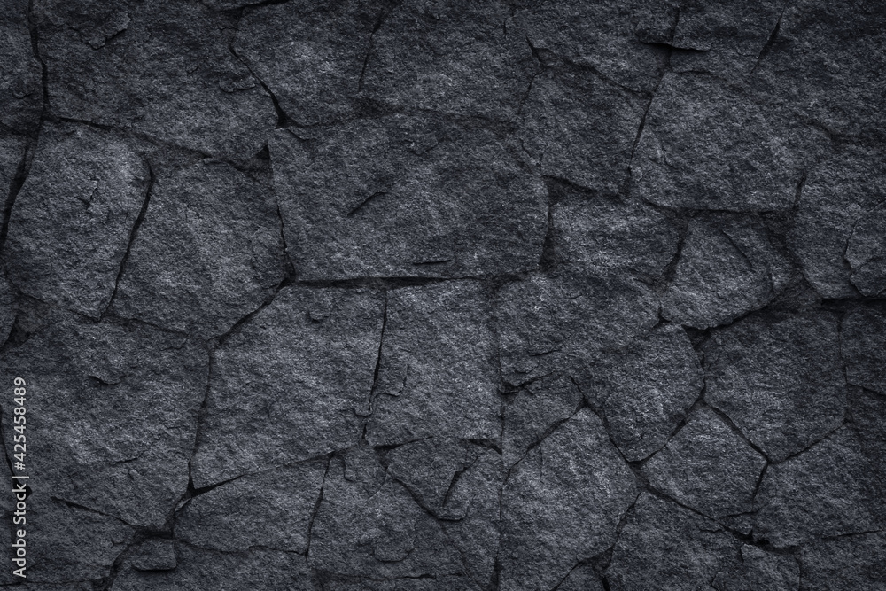 Dark grey slate stone or black stone wall texture background