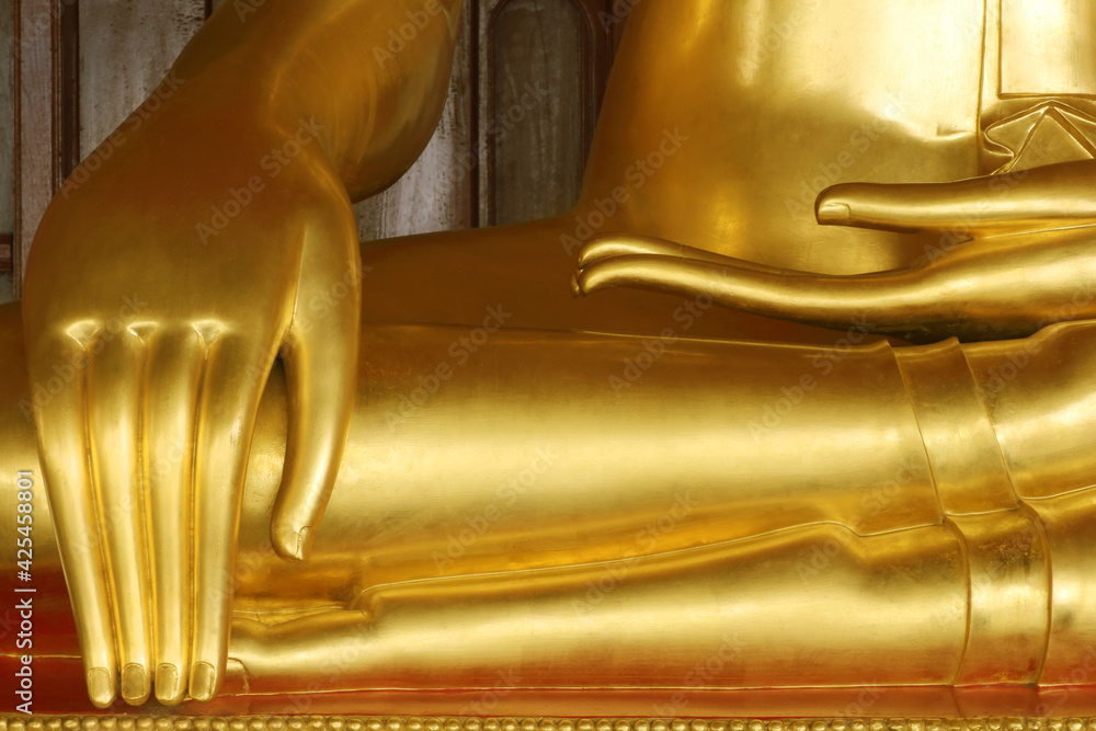 close-up stucco gold of statue of buddha's hand