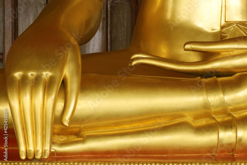 close-up stucco gold of statue of buddha's hand