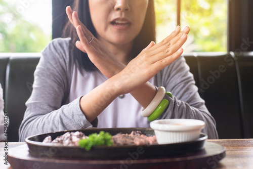 Hands woman refusing food in restaurant No meal Diet food concept