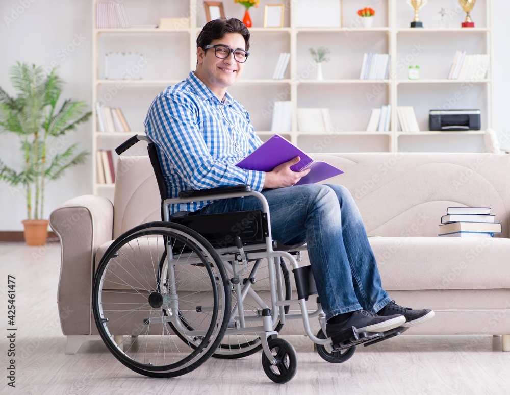 Young student on wheelchair in disability concept Young student on wheelchair in disability concept