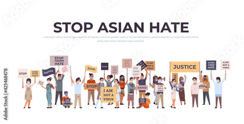 stop asian hate mix race people in masks holding banners against racism support people during covid-19 pandemic
