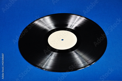 Vintage vinyl record on a blue background.