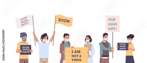 stop asian hate people in masks holding banners against racism support people during coronavirus pandemic