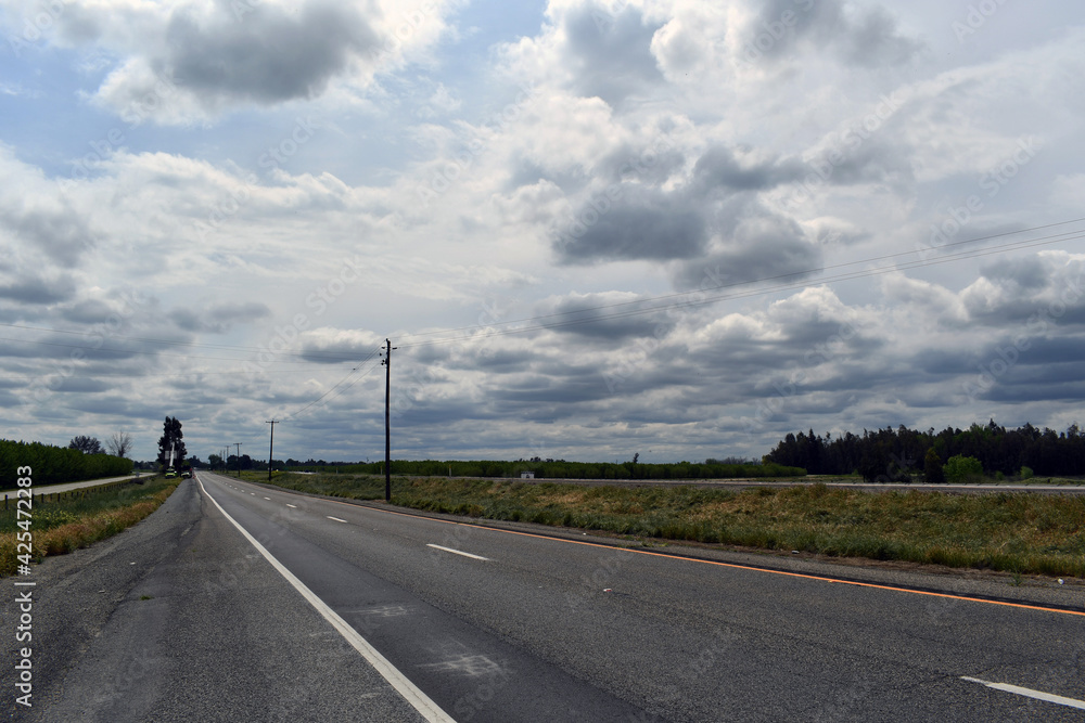 Landscape shot of an empty road during daytime Landscape shot of an empty road during daytime