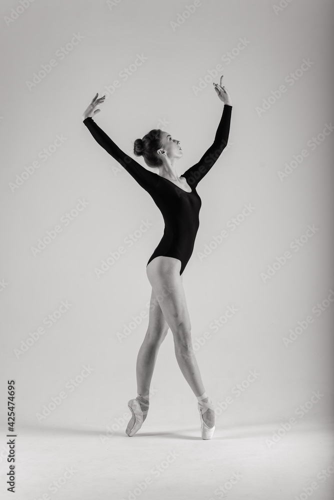 Young ballet dancer isolated on white background