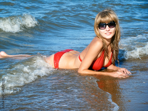 Obraz na płótnie Beautiful Girl in a swimsuit in the sea. Marine Landscape w salonie