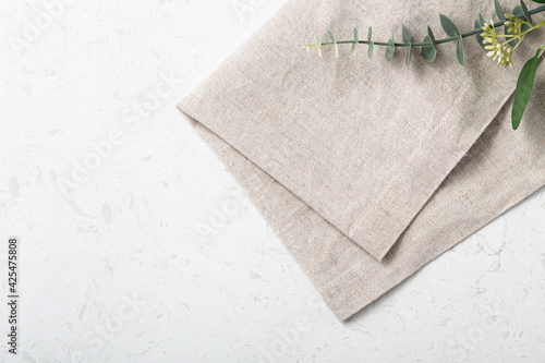 Folded linen napkin on marble table