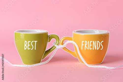 Cups tied together with rop...