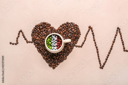 Cup with coffee beans in co...