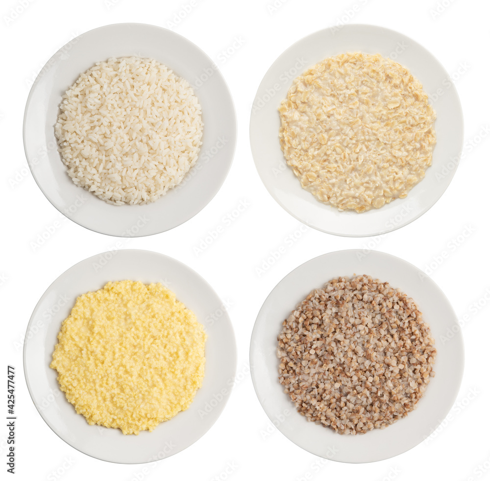 a set of ready-made cereals on white plates . rice, oatmeal, millet and buckwheat a set of ready-made cereals on white plates . rice, oatmeal, millet and buckwheat