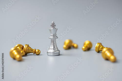 silver Chess king figure stand out from crowd of enermy or opponent. Strategy, Success, management, business planning, disruption, win and leadership concept photo