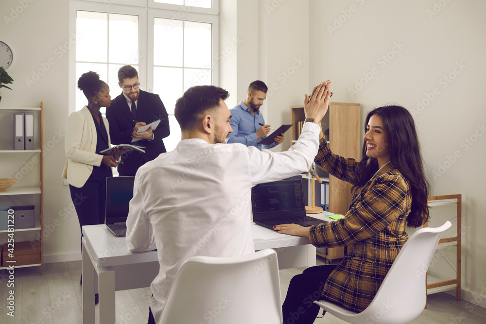 Well Done Happy Enthusiastic People High Five Each Other Sitting At Table In Coworking Office Productive Business Meeting Work Together Making Deal Success Commitment Positive Attitude Concept Stock Photo Adobe Stock